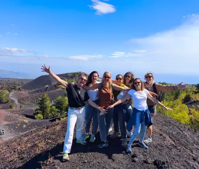 A happy group of travellers on the Etna craters