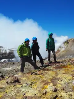 Hikers walking on the summit craters of Mount Etna