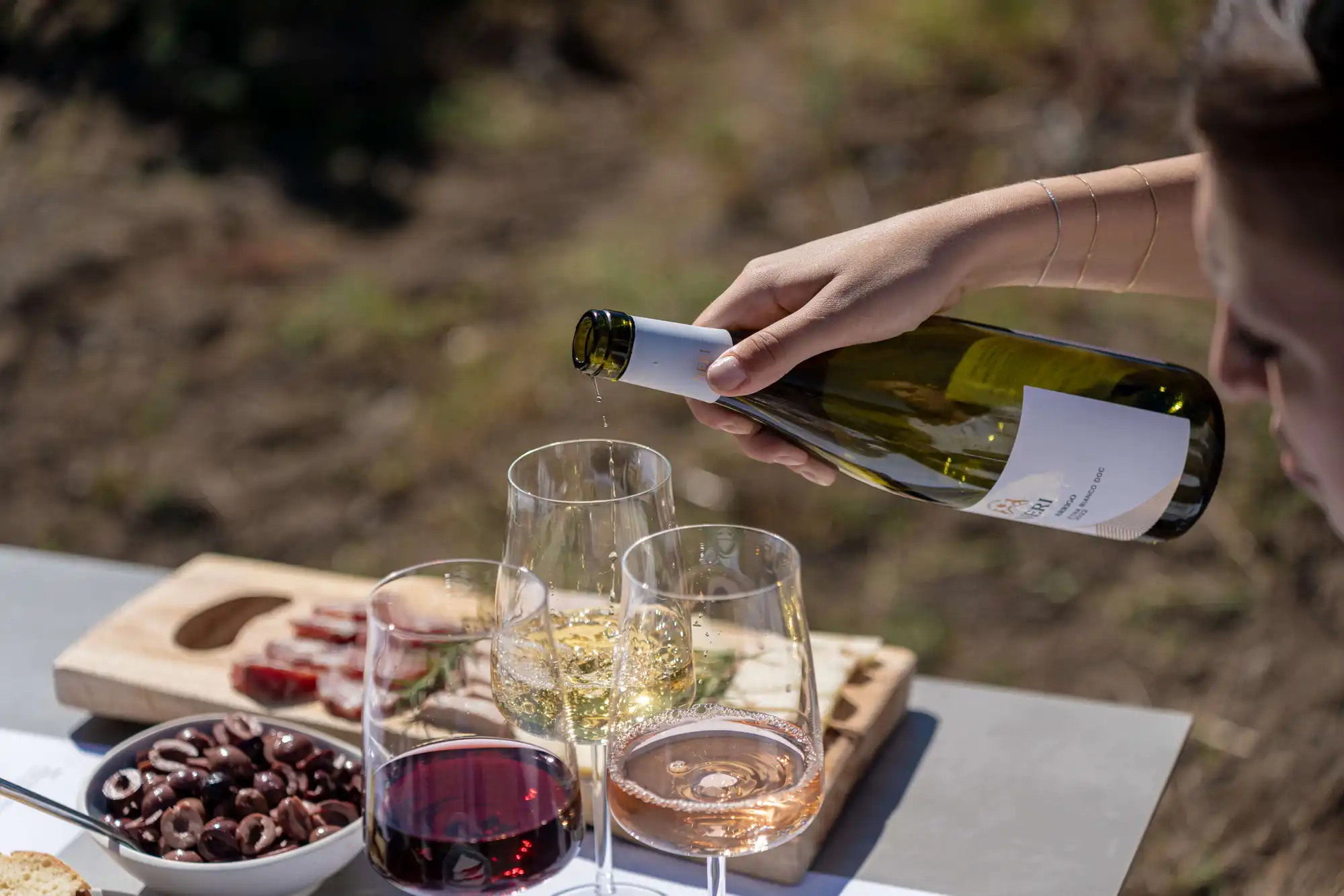 Etna white wine being poured during the tasting